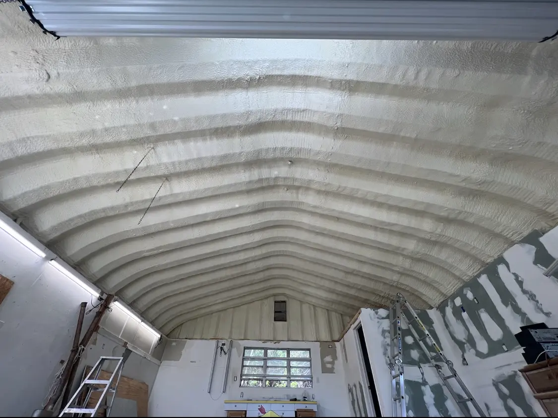 Spray polyurethane foam applied to the underside of a metal roof deck in Red Wing